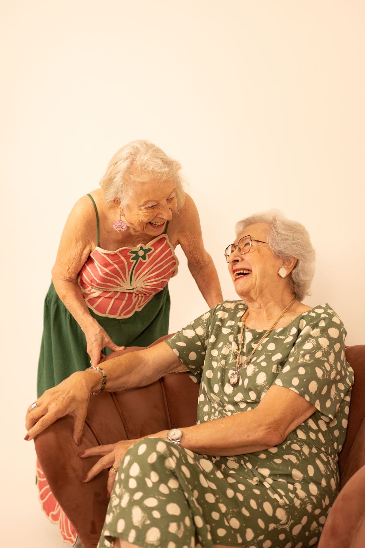 Two older women laughing together